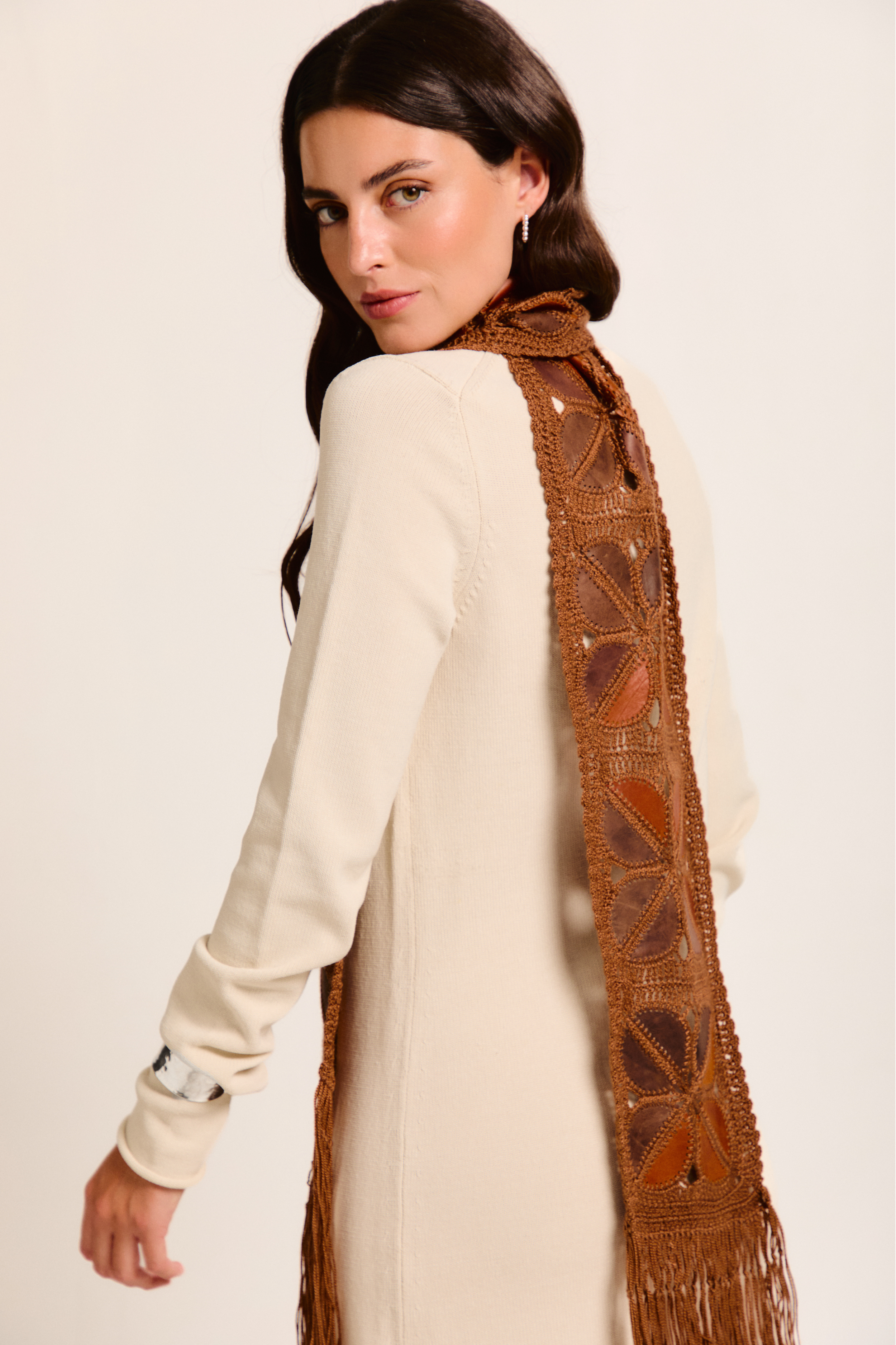 Model wearing a handmade scarf on a neutral background