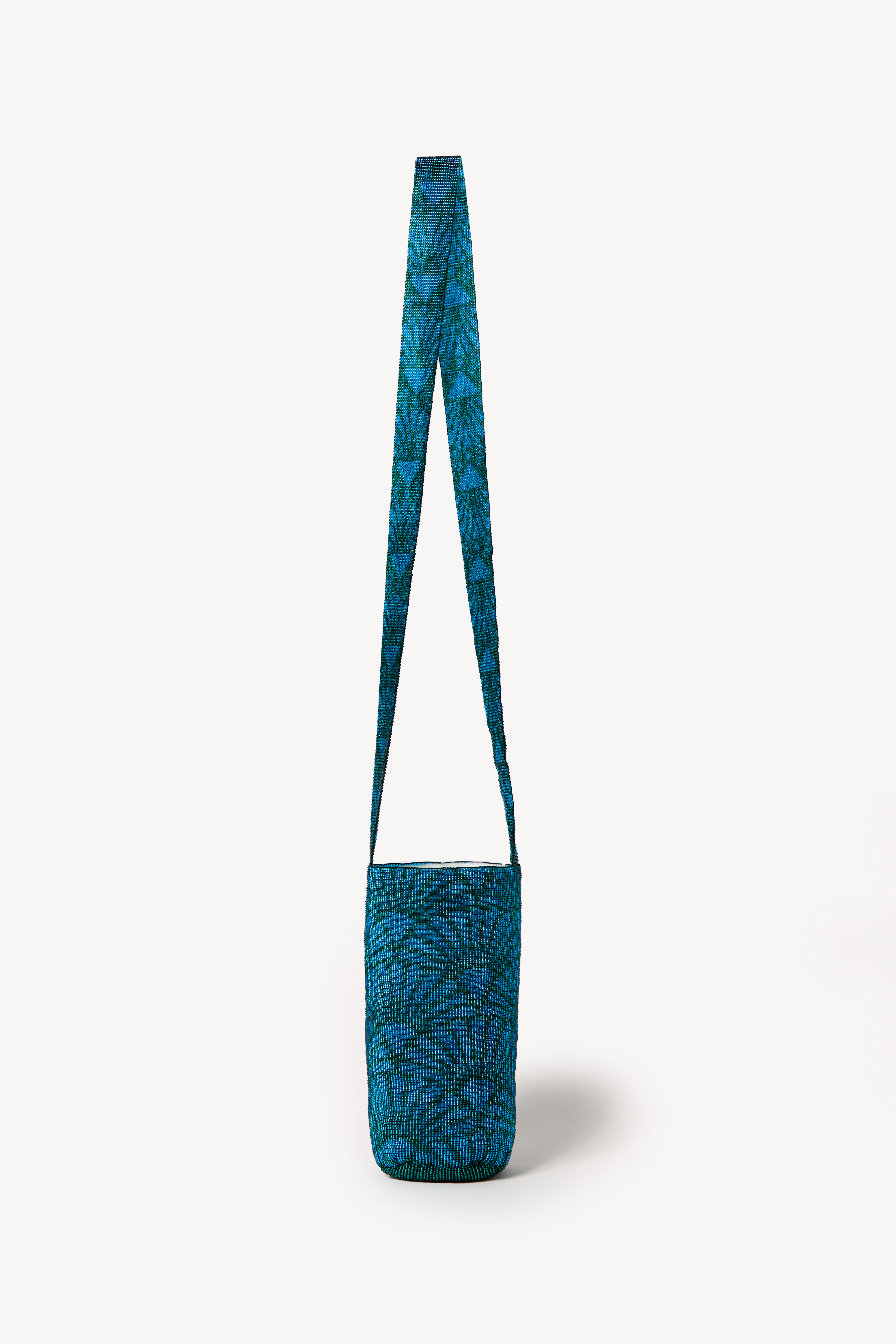 Blue handcrafted bag on a neutral background.