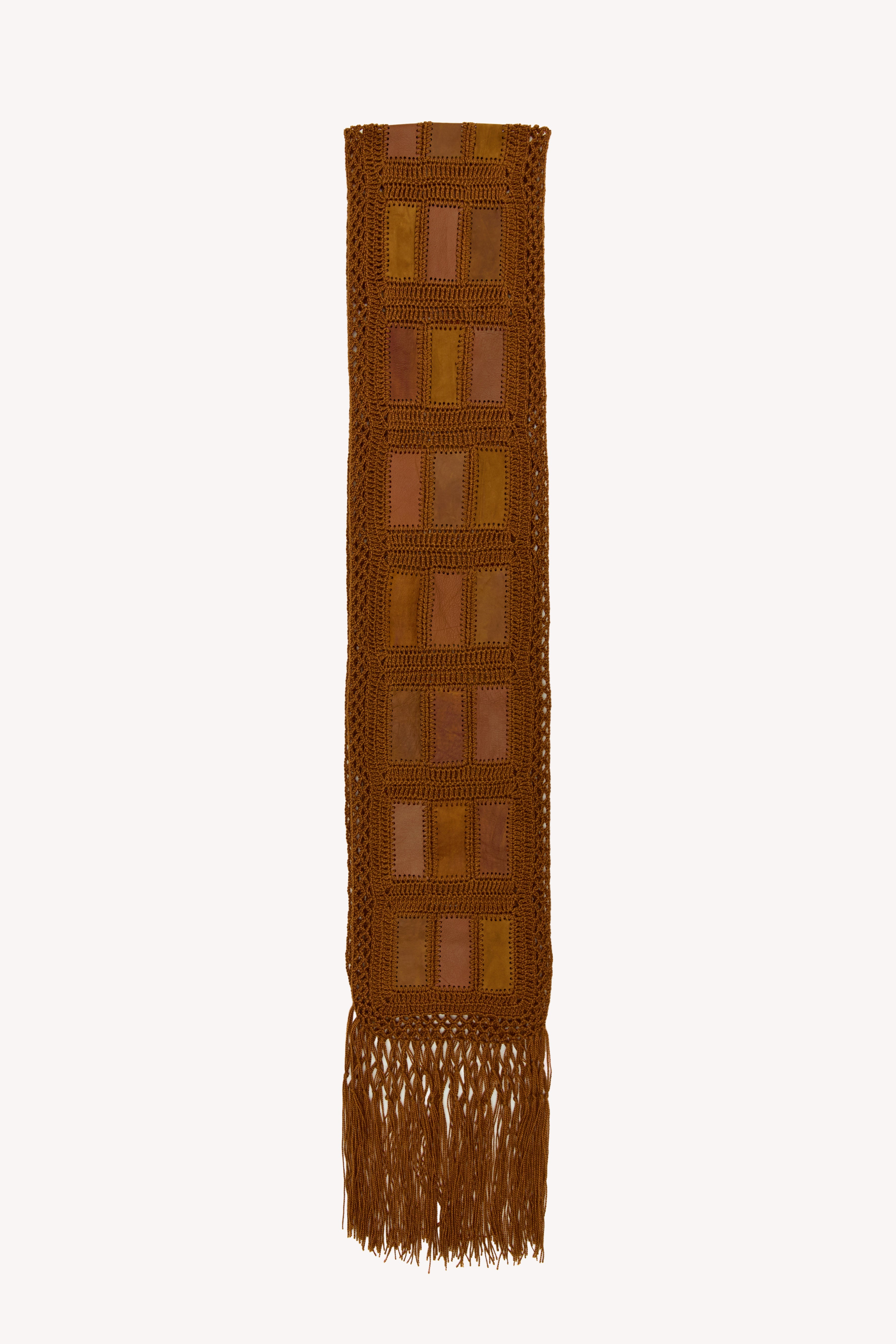 Brown handmade scarf on a neutral background