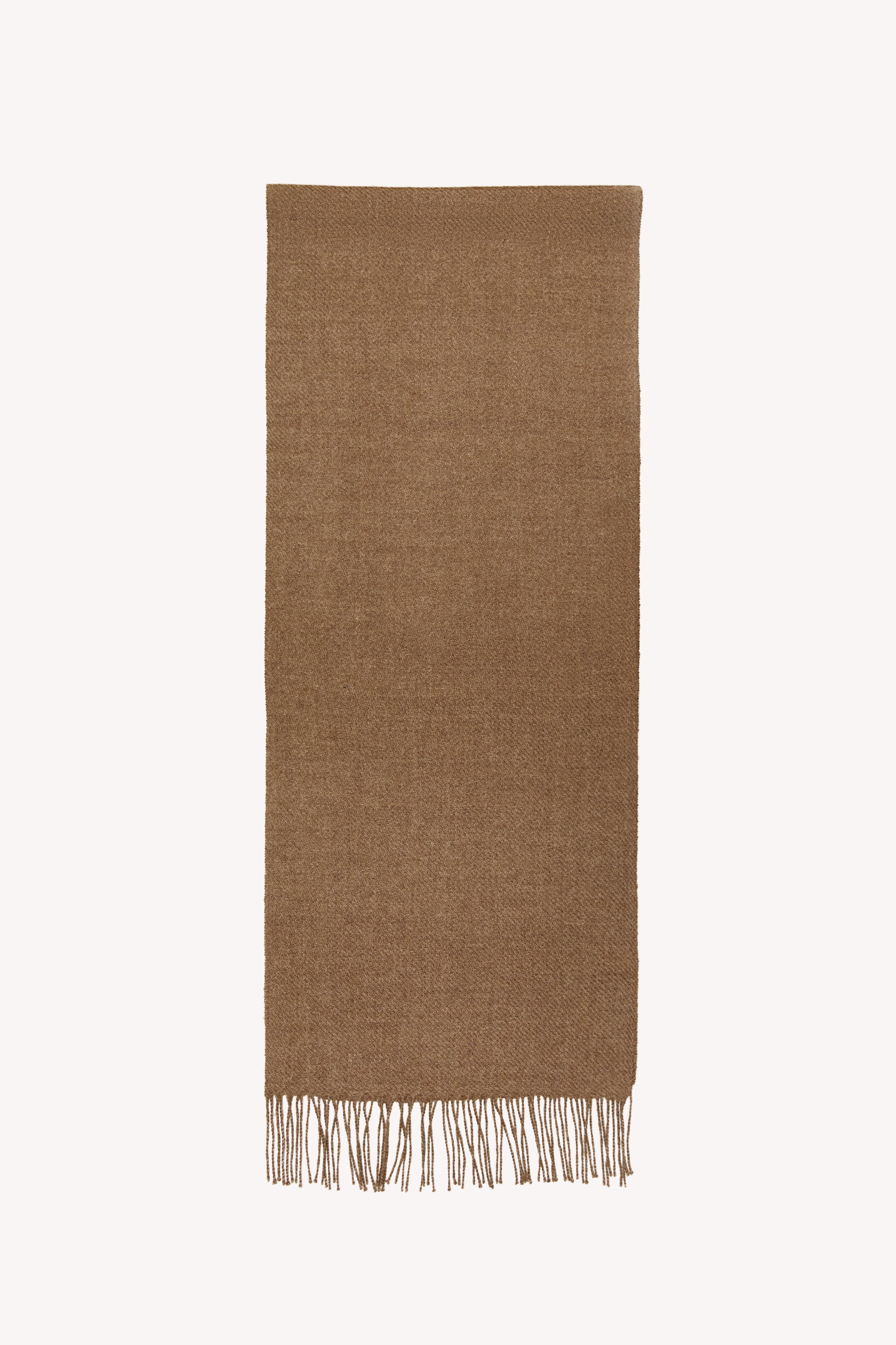 Beige handmade scarf on a neutral background