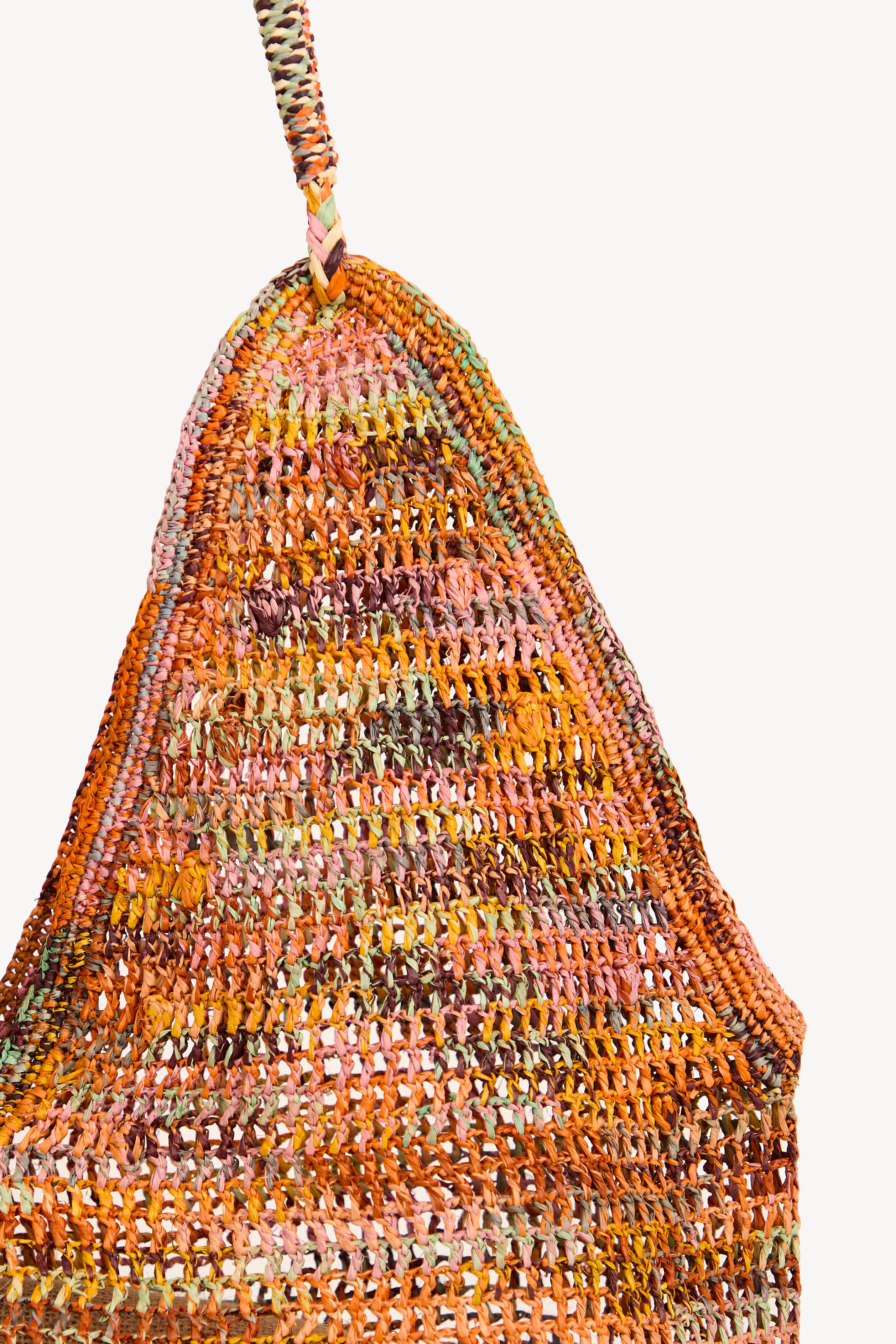 Detail of handwoven raffia showing natural fiber texture and weave.