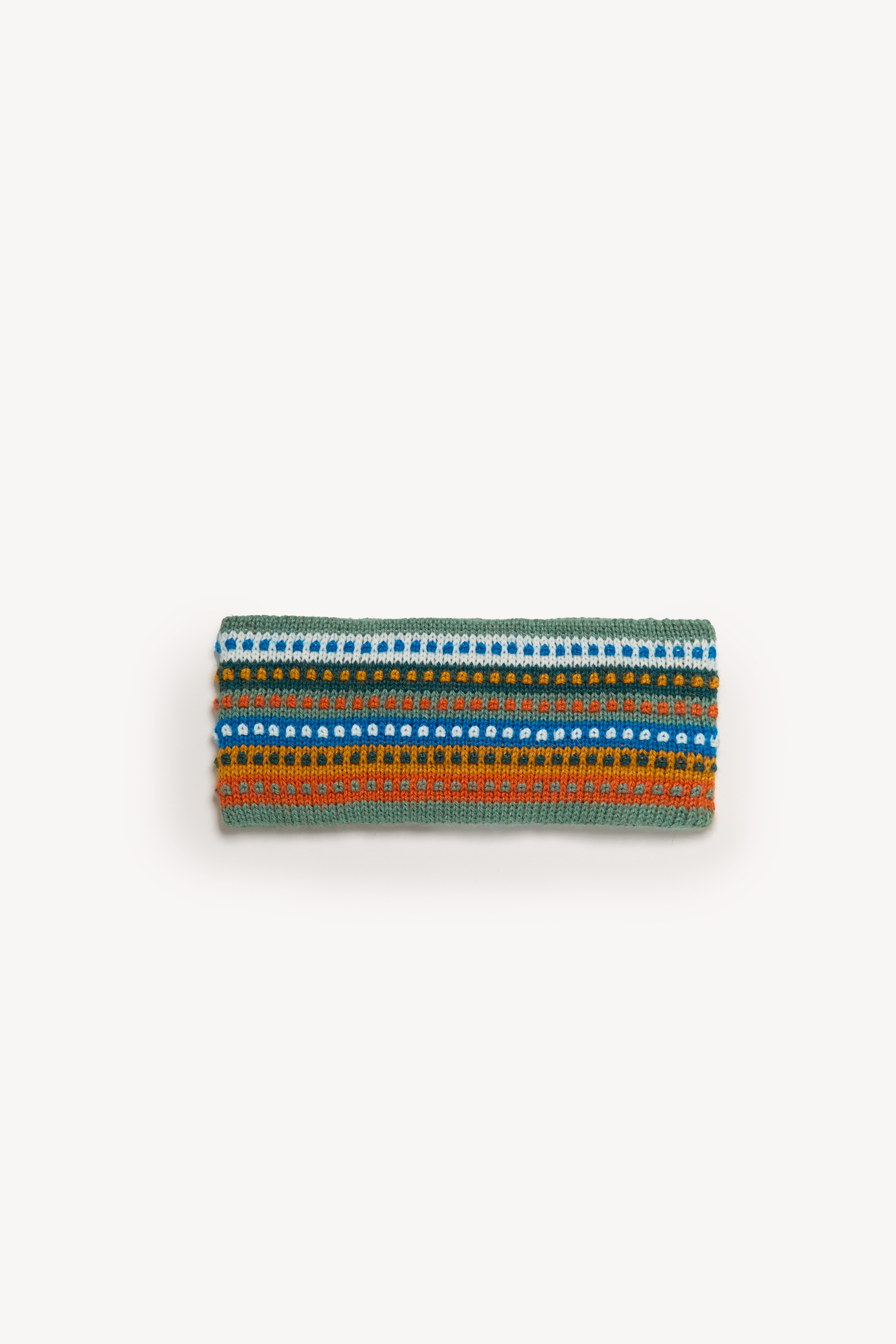 Handmade multicolor headbands displayed on a neutral background