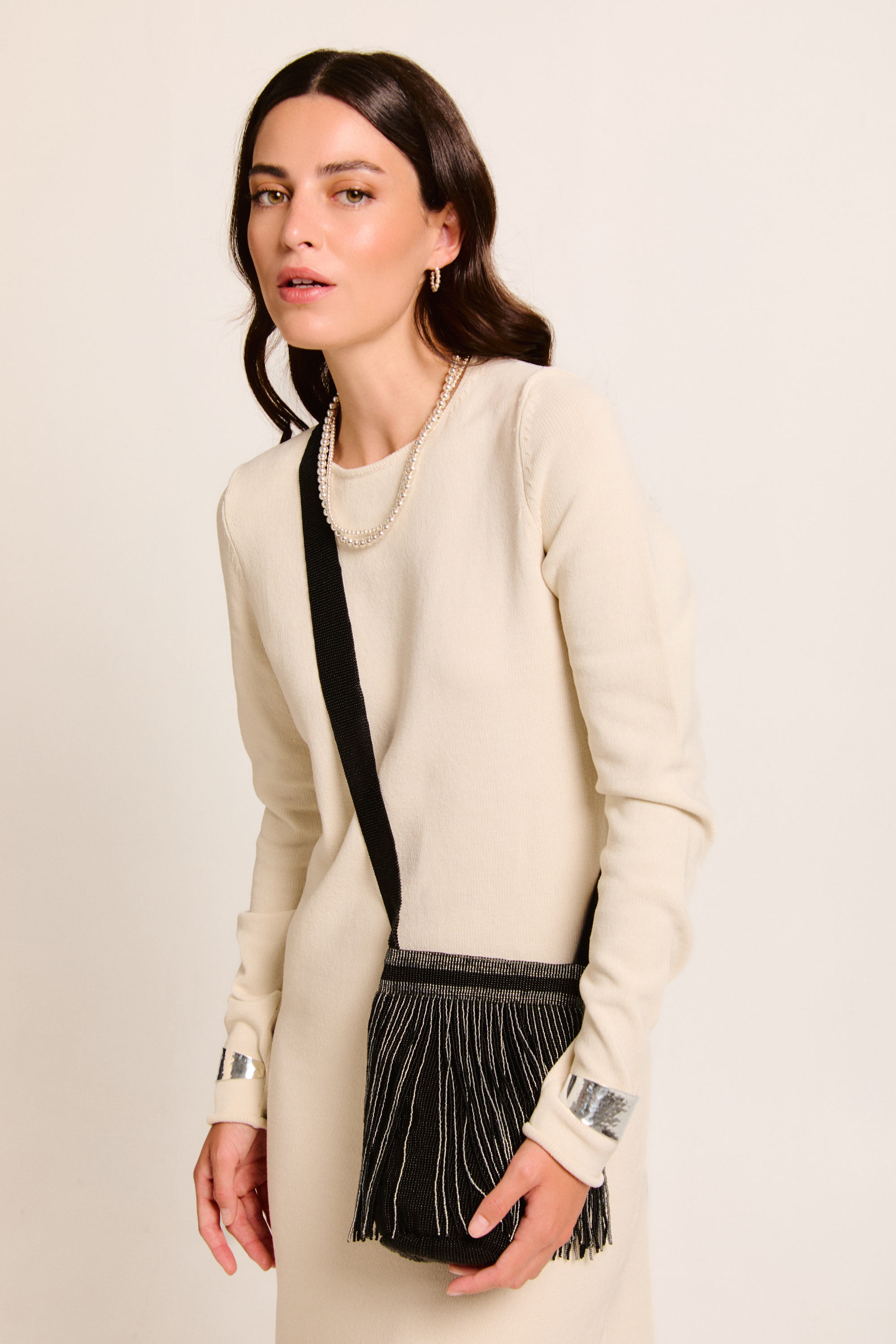 Model with Betsá Fringe Mochila Bag on a neutral background.