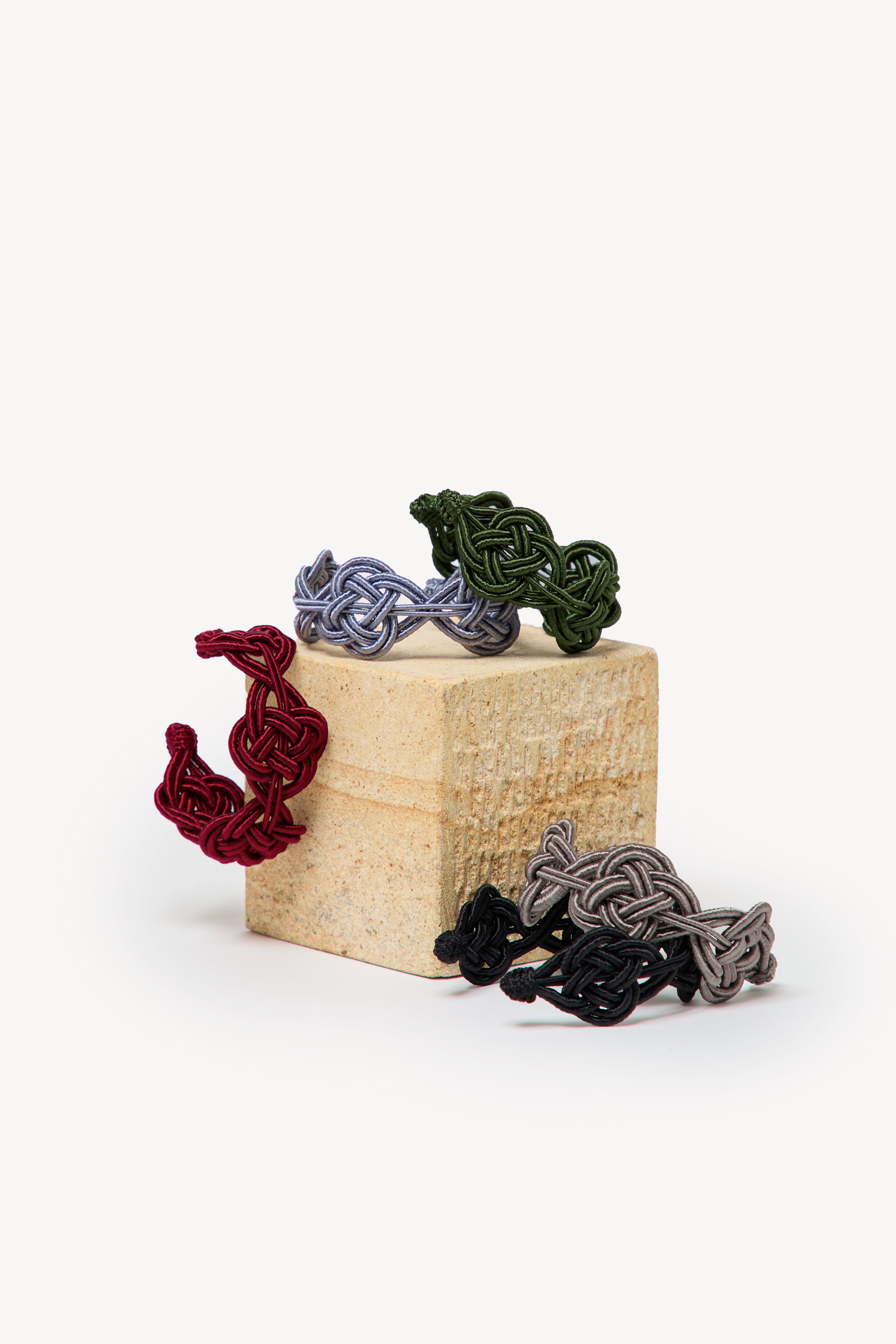 Handmade Nouba bracelets on a box.