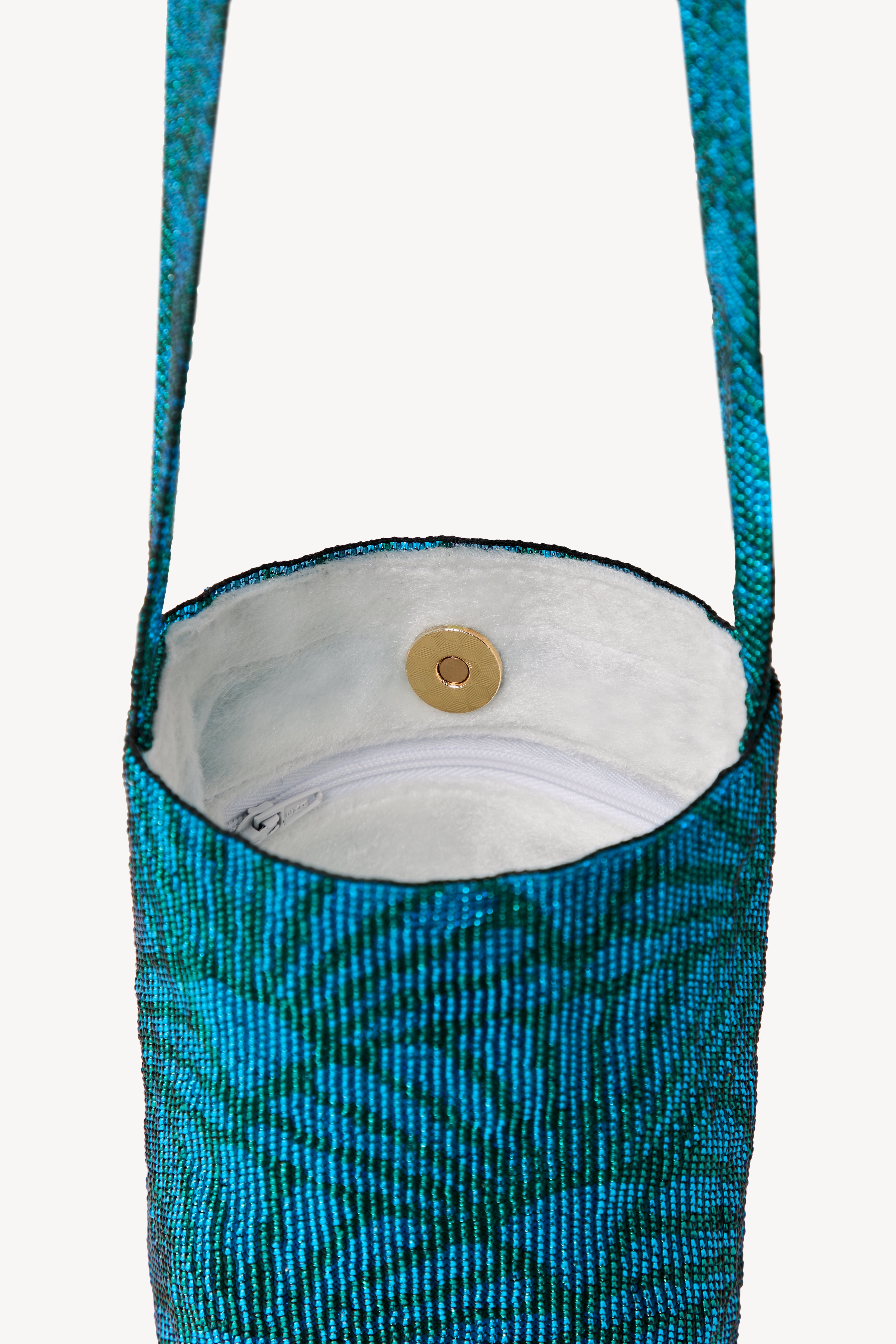 Blue handcrafted bag on a neutral background.