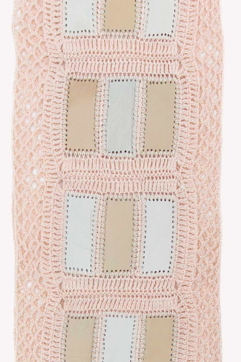 Nude handmade scarf on a neutral background