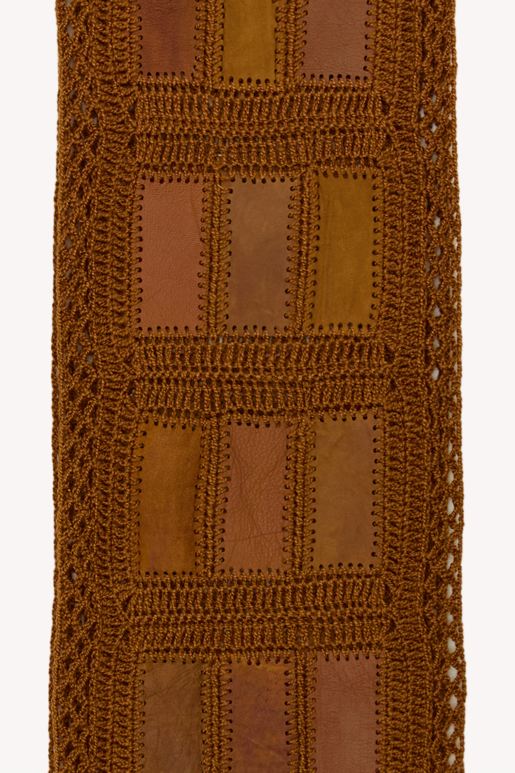 Brown handmade scarf on a neutral background