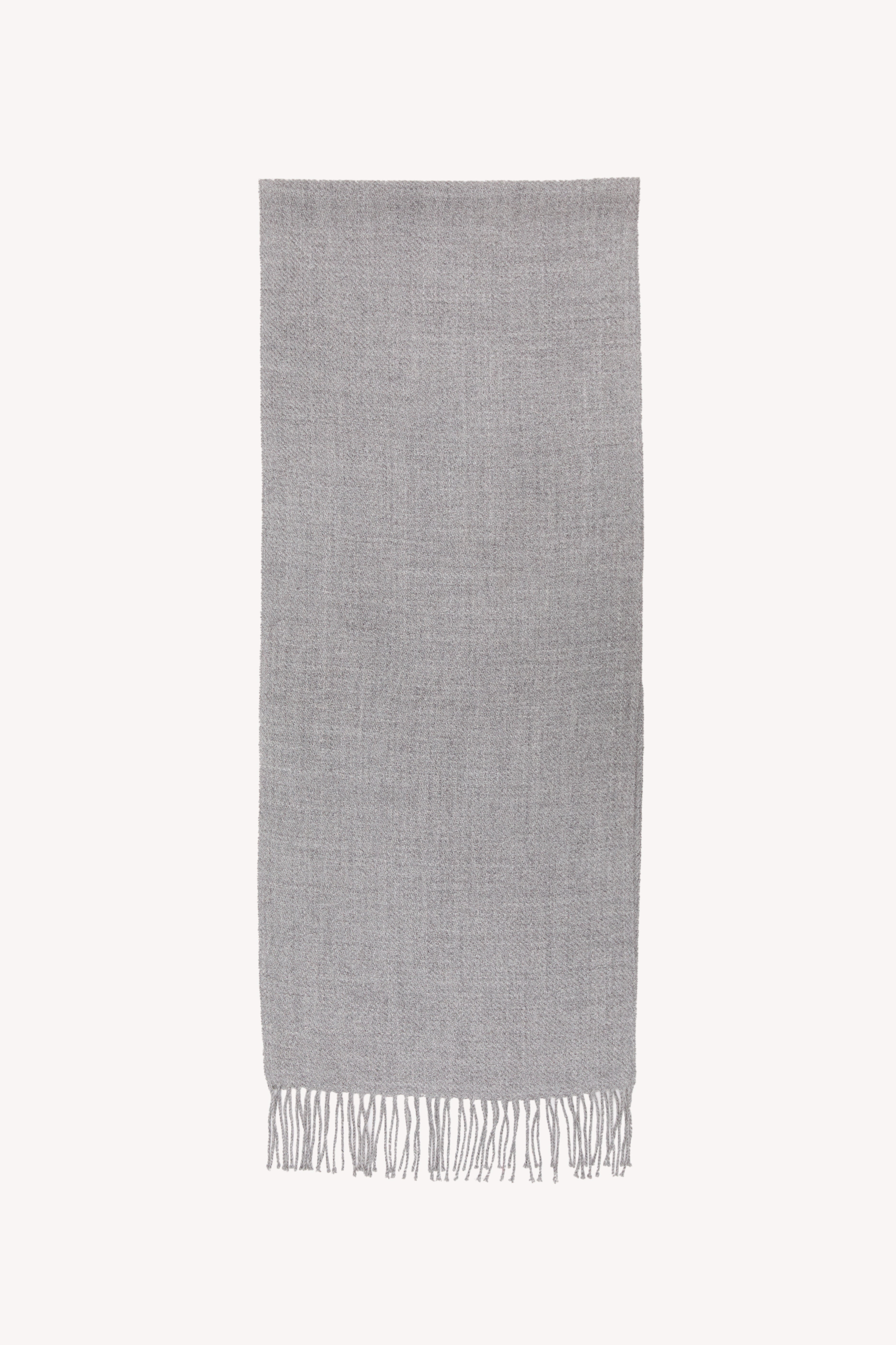 Grey handmade scarf on a neutral background