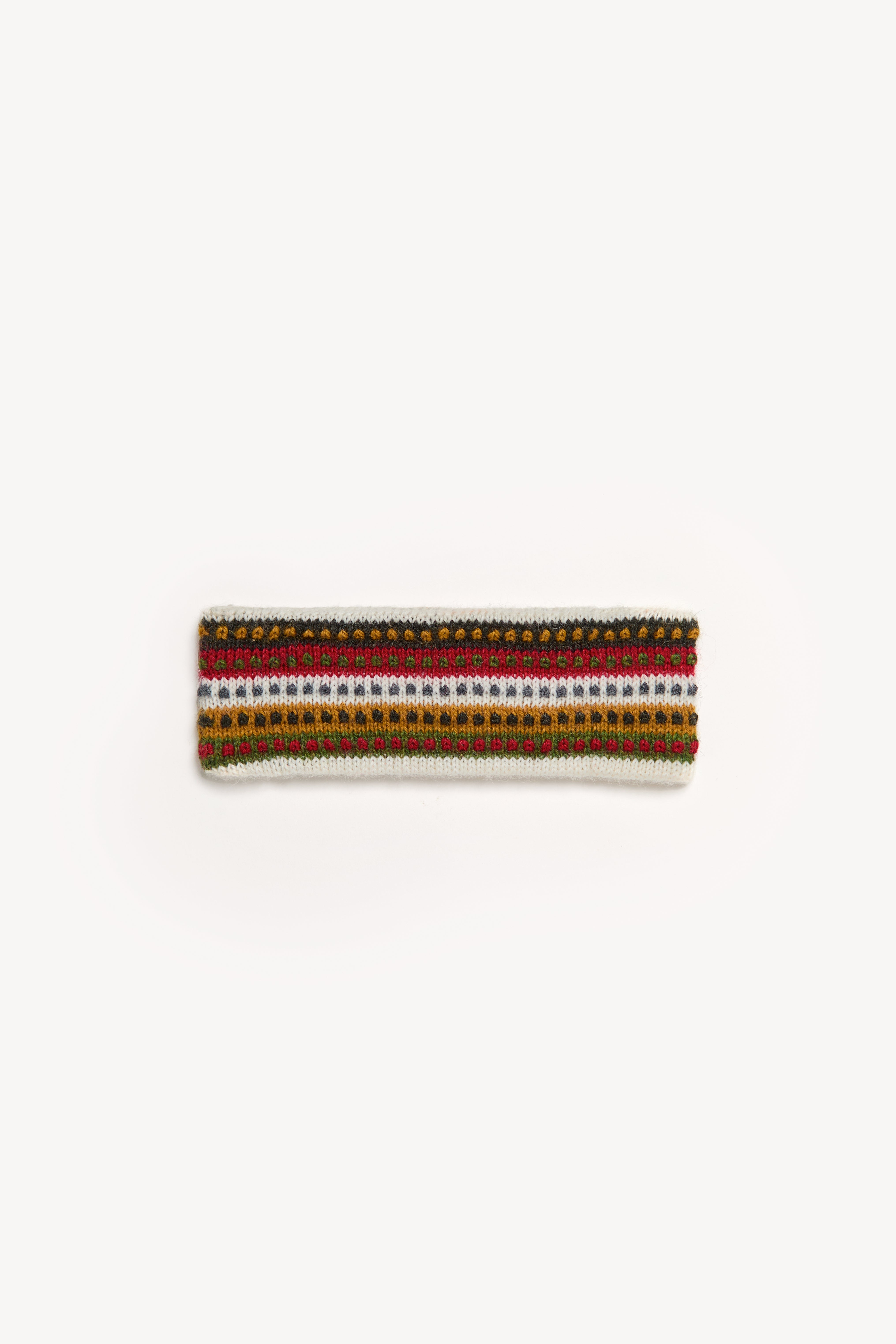 Handmade multicolor headbands displayed on a neutral background
