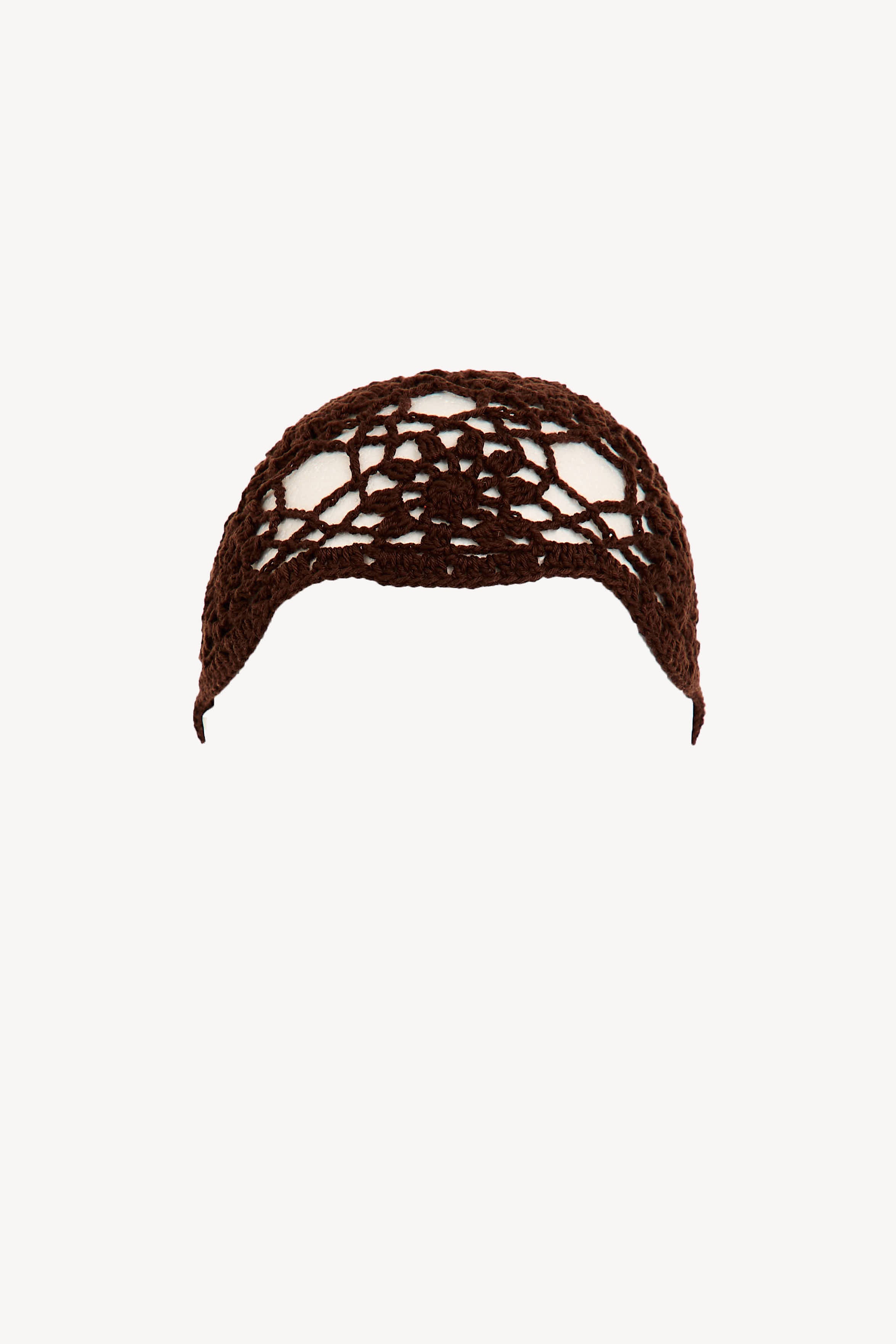 Brown cotton crochet cap with open floral design, handmade in Ecuador.