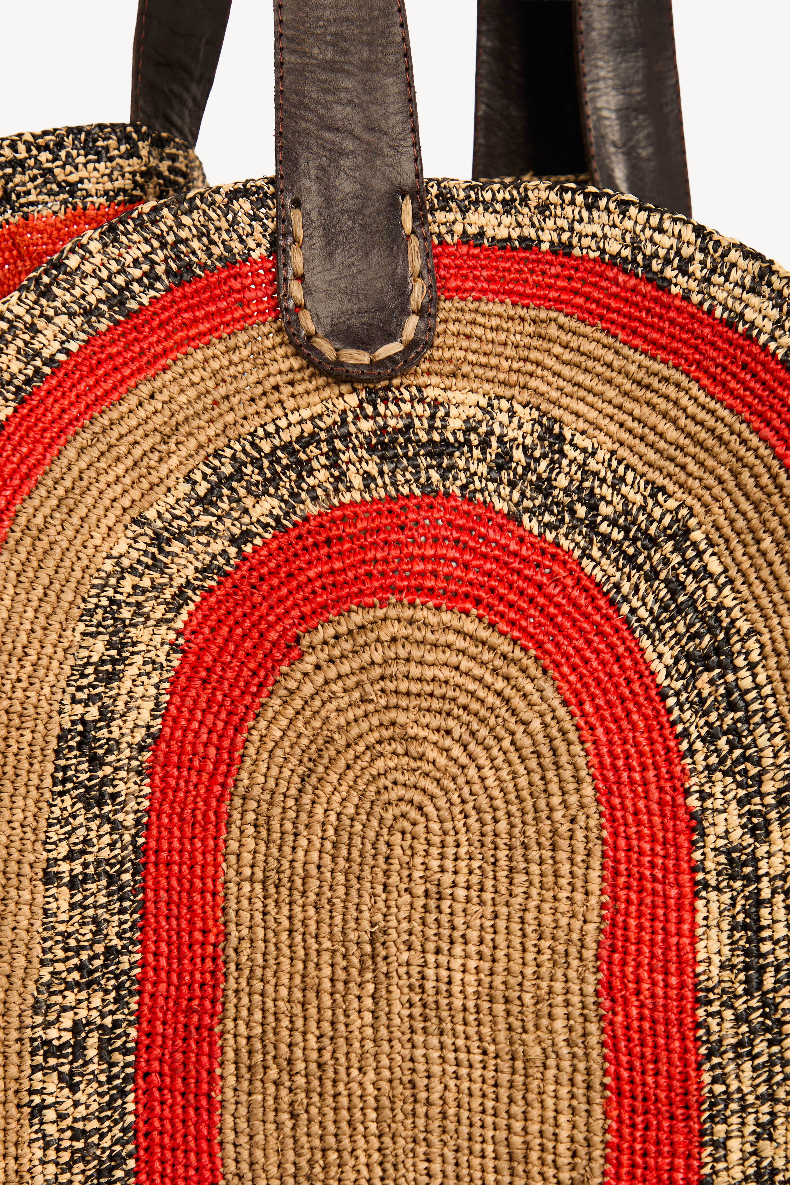 Detail of handwoven raffia showing natural fiber texture and weave.