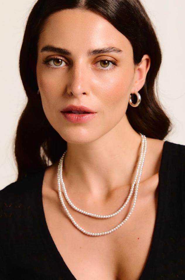 Model wearing a handmade necklace.