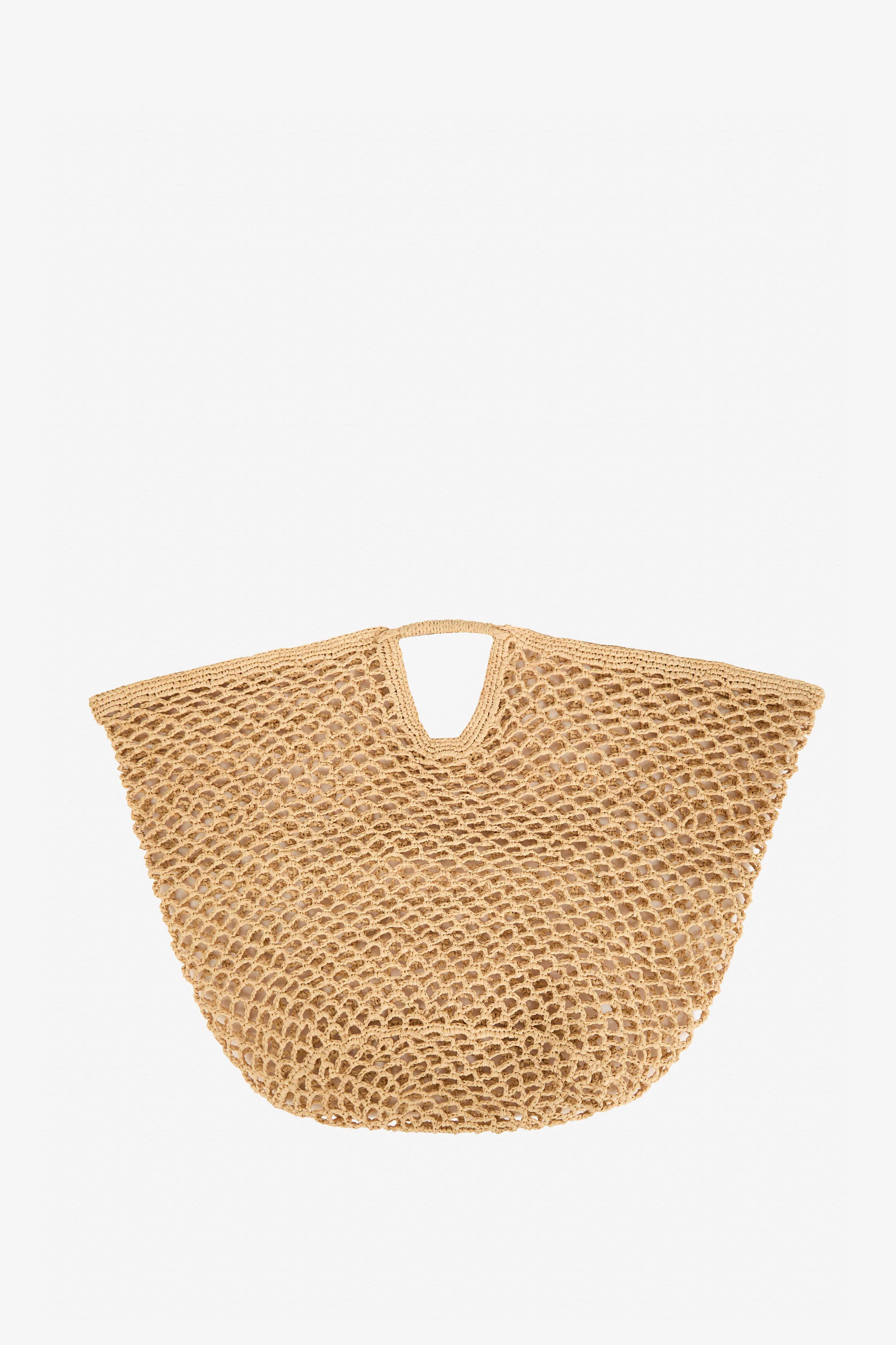 Handwoven beige raffia handbag with open weave design, lightweight bag handmade in Madagascar.